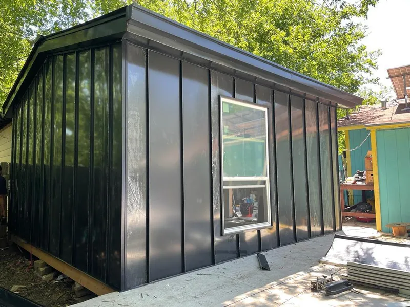 Black standing seam metal wall panels for Metal Roof Installation in West Loch Estate